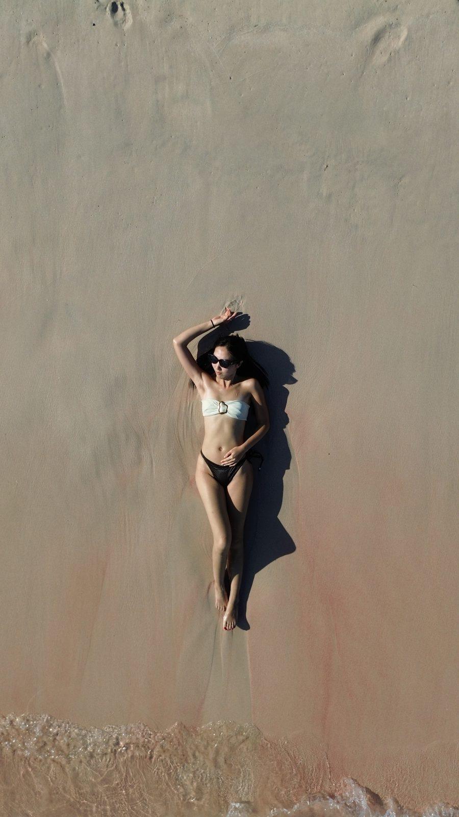 Swim Snorkel – woman lying on sand, aerial (KEXI 行程实拍)