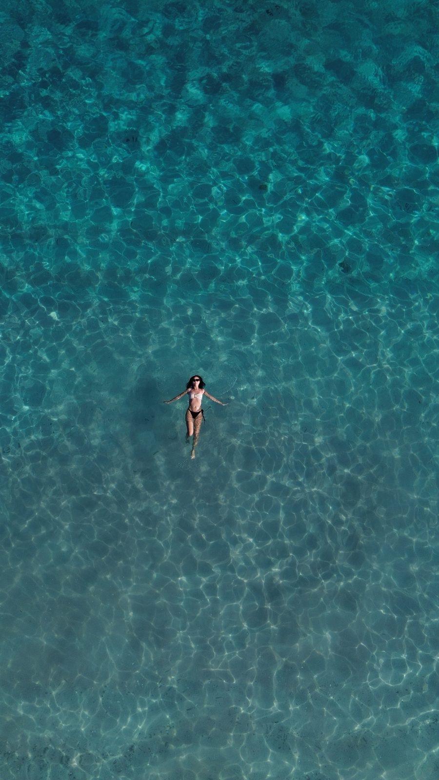 Swim Snorkel – aerial single swimmer in turquoise water (KEXI 行程实拍)
