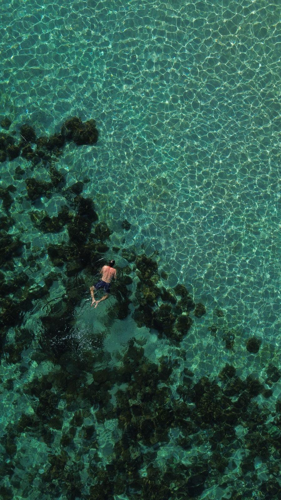 Swim Snorkel – aerial swimmer in turquoise water near reef (KEXI 行程实拍)