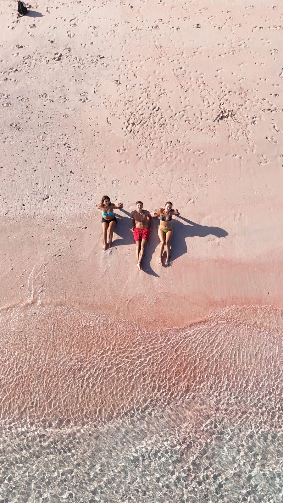 Pink Beach – four people on pink sand, drone (Real photo from a KEXI trip)